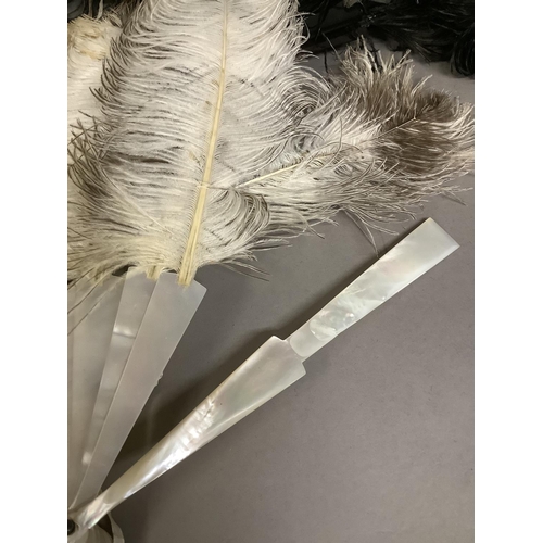 99 - A large black ostrich feather fan, the monture of tortoiseshell, the upper guard fitted with a detac... 