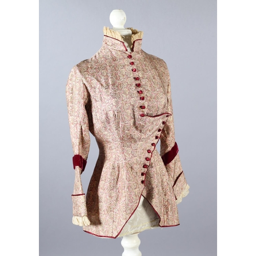 258 - Two most unusual silk bodices, the first in a very soft patterned silk trimmed with ruby velvet and ... 