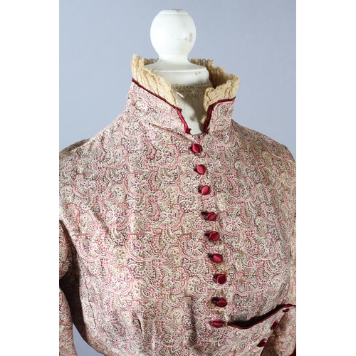 258 - Two most unusual silk bodices, the first in a very soft patterned silk trimmed with ruby velvet and ... 