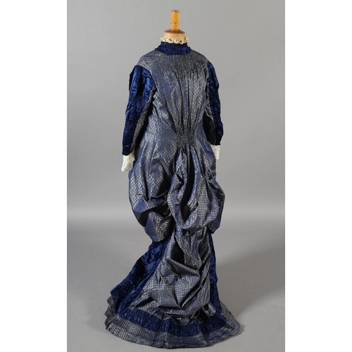 259 - A fine royal blue silk gown c 1880’s, bustle back, collar, sleeves, skirt with rushing, slightly lig... 