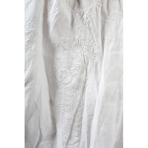 260 - An ornate Edwardian fine white cotton blouse with full sleeves, high neck and floral front embroider... 