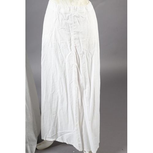 260 - An ornate Edwardian fine white cotton blouse with full sleeves, high neck and floral front embroider... 