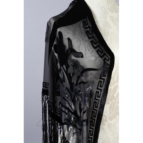 355 - Two 20th century black cut velvet garments, one a draped top, hip-length, the other a fringed shawl,... 