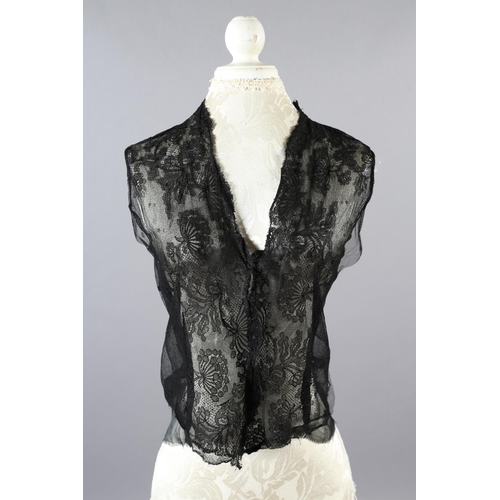 355 - Two 20th century black cut velvet garments, one a draped top, hip-length, the other a fringed shawl,... 