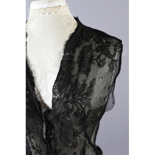 355 - Two 20th century black cut velvet garments, one a draped top, hip-length, the other a fringed shawl,... 