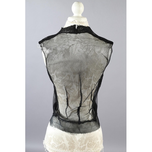 355 - Two 20th century black cut velvet garments, one a draped top, hip-length, the other a fringed shawl,... 