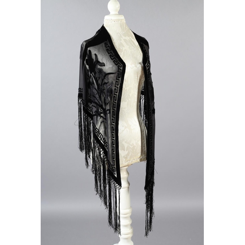 355 - Two 20th century black cut velvet garments, one a draped top, hip-length, the other a fringed shawl,... 