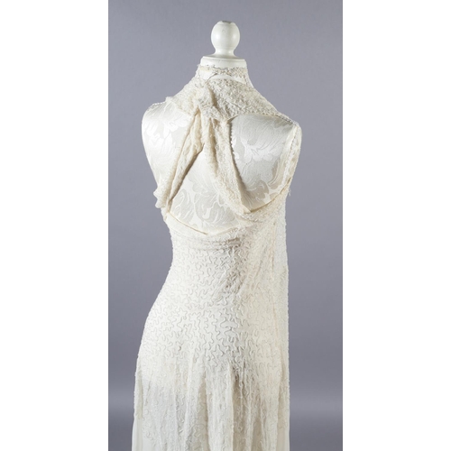 360 - A cream 1920’s chiffon wedding dress and shoulder cape, decorated with clear beads, the dress sleeve... 