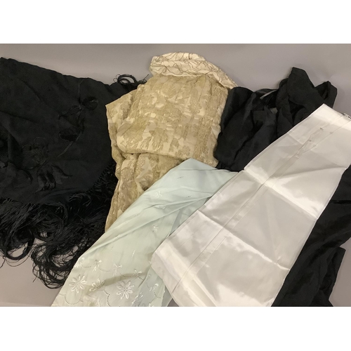 346 - A quantity of silk and other petticoats, 19th and 20th centuries, a black embroidered shawl and lamé... 