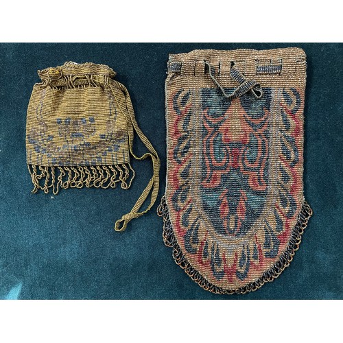 320 - Two early 20th century woven beaded bags, both with draw thread beaded straps, both fringed, neither... 