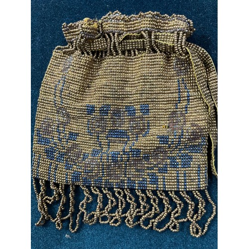 320 - Two early 20th century woven beaded bags, both with draw thread beaded straps, both fringed, neither... 