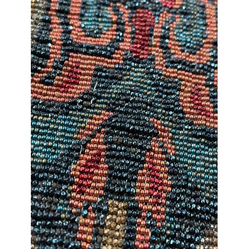 320 - Two early 20th century woven beaded bags, both with draw thread beaded straps, both fringed, neither... 