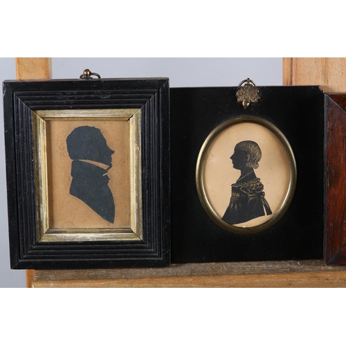 26 - A Victorian silhouette of a young woman detailed in gilt, 7.5cm x 5.75cm, rosewood frame together wi... 