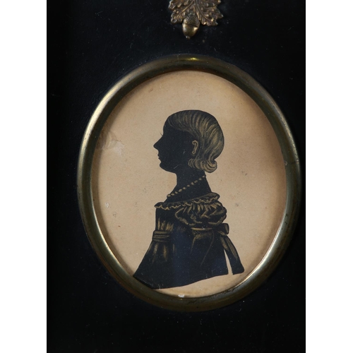 26 - A Victorian silhouette of a young woman detailed in gilt, 7.5cm x 5.75cm, rosewood frame together wi... 