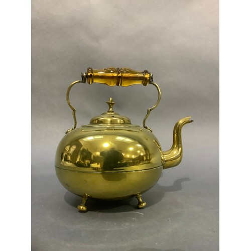 7 - A Victorian brass toddy kettle with amber glass handle