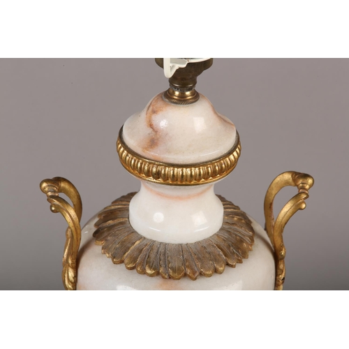 19 - A GILT METAL MOUNTED MARBLE TABLE LAMP OF BALUSTER VASE SHAPE WITH TWIN FOLIATE HANDLES, leaf collar... 