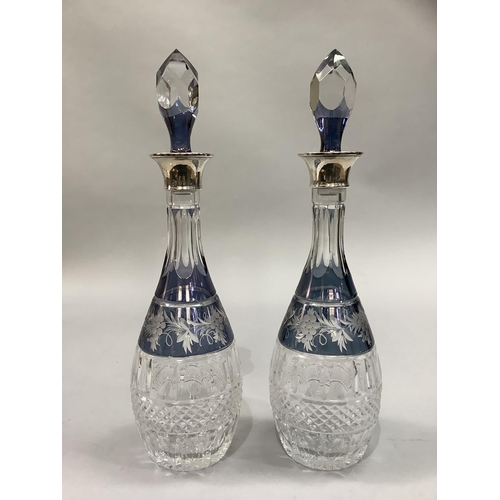 15 - A pair of George V fluted and hob nail cut glass decanters etched with a band of grape vines with si... 