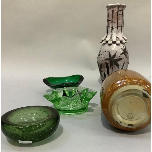 133 - Three green glass dishes or ashtrays, a Studio Pottery vase of brown speckled glaze and another with... 