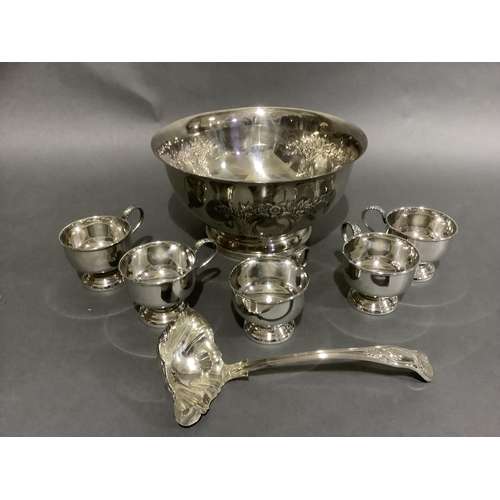 141 - A good silver plated punch bowl with six cups and ladle, embossed with flowers and blind cartouche,