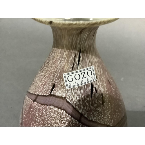 51 - A Gozo glass scent bottle with clear glass spherical stopper, the ovoid body of opalescent aubergine... 