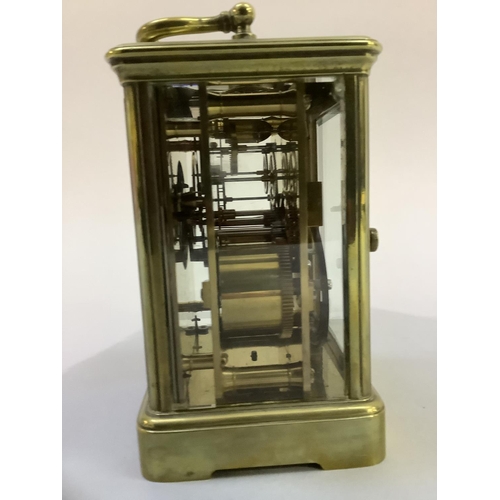 20 - A late 19th century brass carriage clock,  movement striking on a gong,  the enamelled dial with bla... 