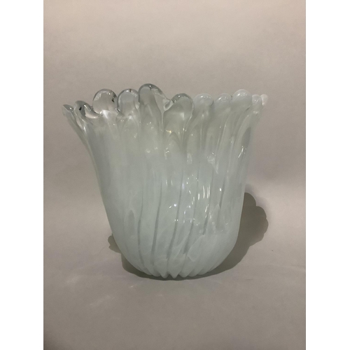 24 - A white swirl and clear glass vase of petalated form and oval outline, 26cm high