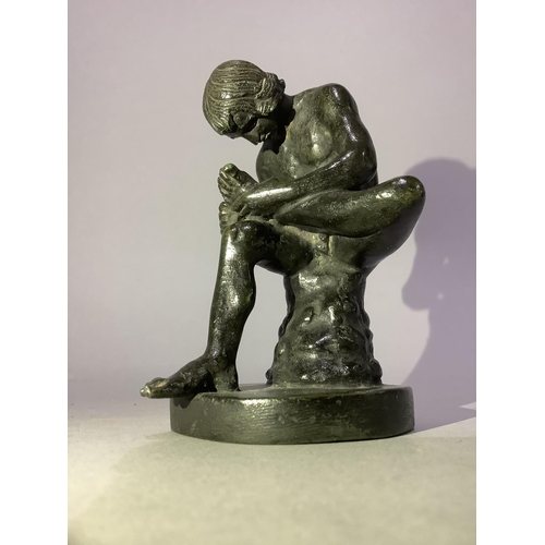 27 - A bronzed figure of Spinario, naked boy sitting on a rock intent on removing a thorn from his foot, ... 