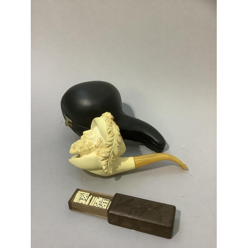 31 - A modern Meerschaum pipe, the bowl carved as a grinning bearded man with feathered hat, in fitted ca... 