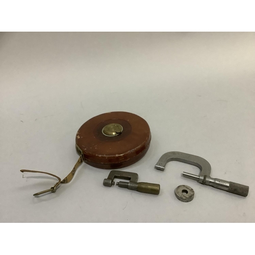 40 - Rabone and Sons leather cased tape measure, 66feet no.251 together with two steel gauges