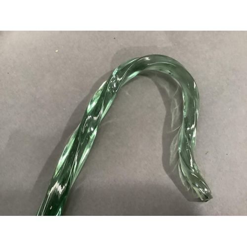 305 - A 19th century Nailsea type green wrythern glass walking cane, 107cm long