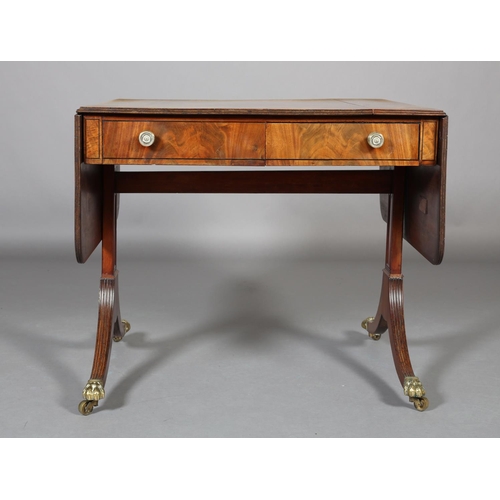 367 - A Regency mahogany and rosewood crossbanded sofa table with ebony stringing, having a drawer and dum... 