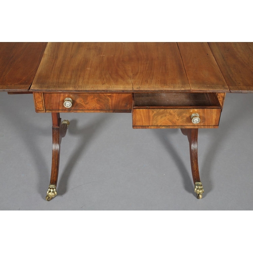 367 - A Regency mahogany and rosewood crossbanded sofa table with ebony stringing, having a drawer and dum... 