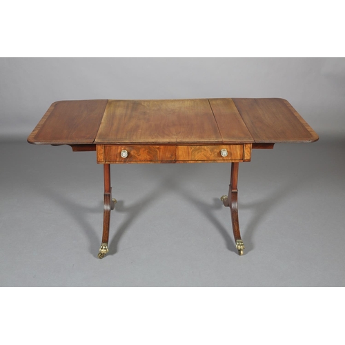 367 - A Regency mahogany and rosewood crossbanded sofa table with ebony stringing, having a drawer and dum... 