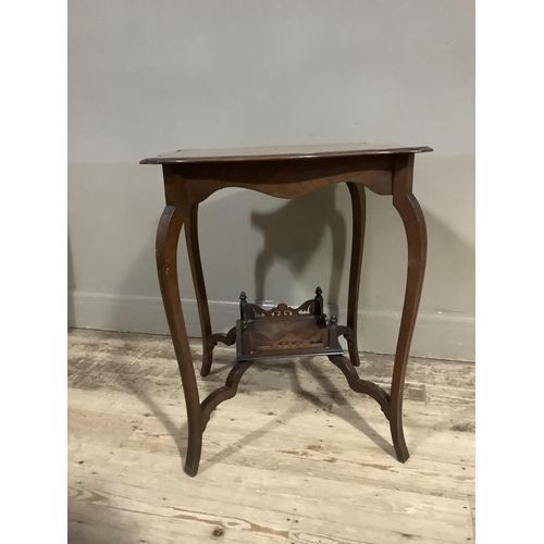 368 - An Edwardian mahogany window table of square serpentine outline with under tier