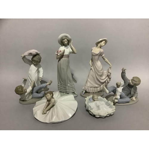 116 - A collection of Nao figures including Edwardian girls, ballerina, child in a cradle, children having... 