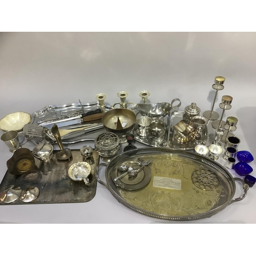 151 - A quantity of EPNS and stainless steel including gallery trays, divided trays, candle stands, sauceb... 