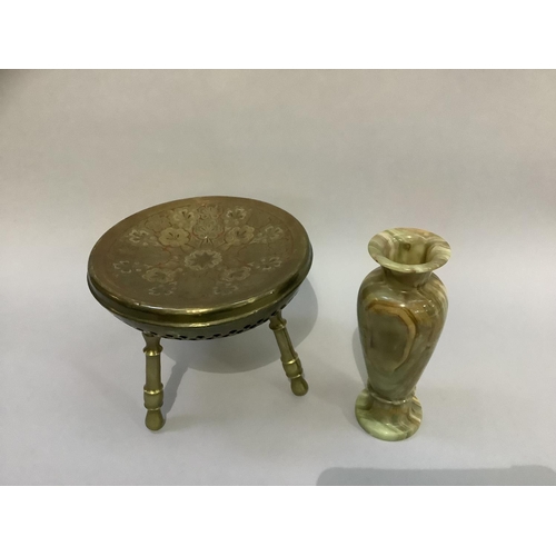 187 - An Indian or Moroccan brass heater on three legs together with an onyx vase