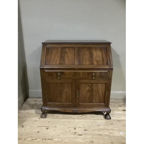 337 - A 1920s mahogany bureau having gadroon carved edges, twin indented panel fall front, fitted interior... 