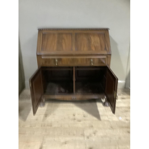 337 - A 1920s mahogany bureau having gadroon carved edges, twin indented panel fall front, fitted interior... 