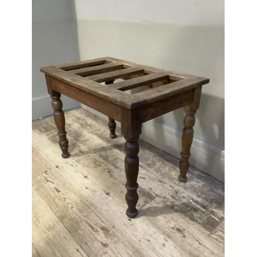 344 - An oak and elm luggage stand with slatted top on turned legs, 61cm x 38cm