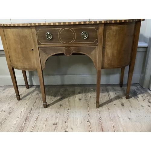 347 - An early 19th century semi bow front sideboard, cross banded and with boxwood line inlay, having a d... 