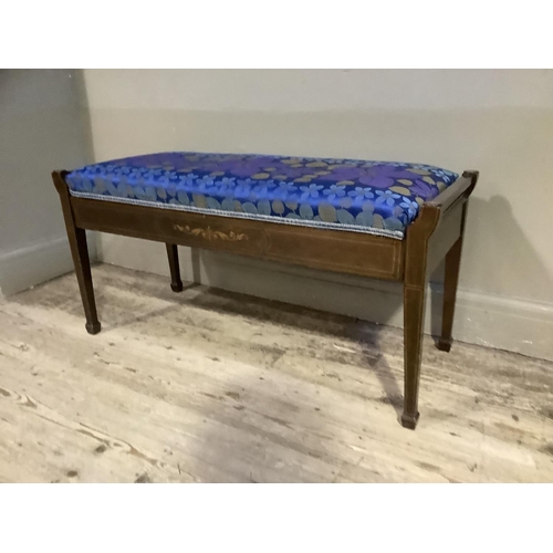 350 - An Edwardian mahogany and satinwood inlaid duet stool having an upholstered lift up seat on square t... 