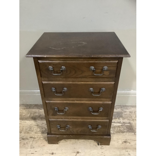 353 - A reproduction chest of four graduated drawers on bracket feet, 43cm wide x 63cm,