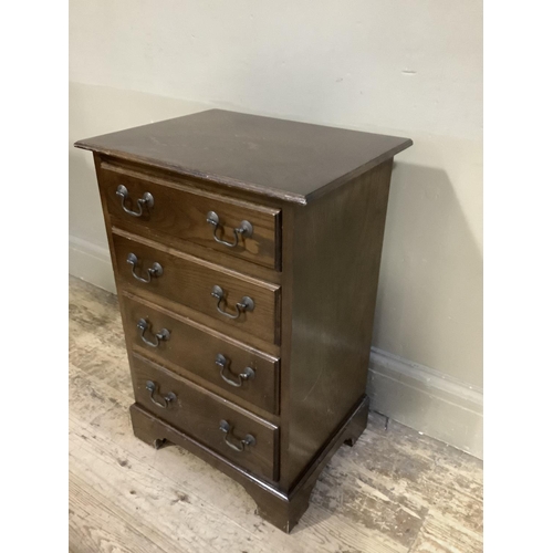 353 - A reproduction chest of four graduated drawers on bracket feet, 43cm wide x 63cm,