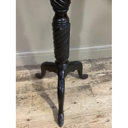 357 - A mahogany writhen torchere on tripod base with paw feet, 153cm high