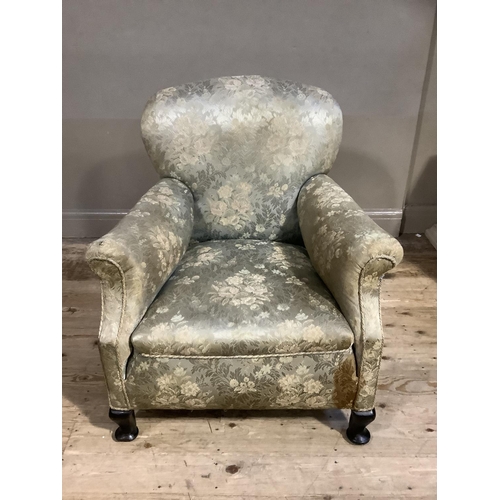 365 - An early 20th century upholstered armchair having a rounded back and on short cabriole legs with pad... 