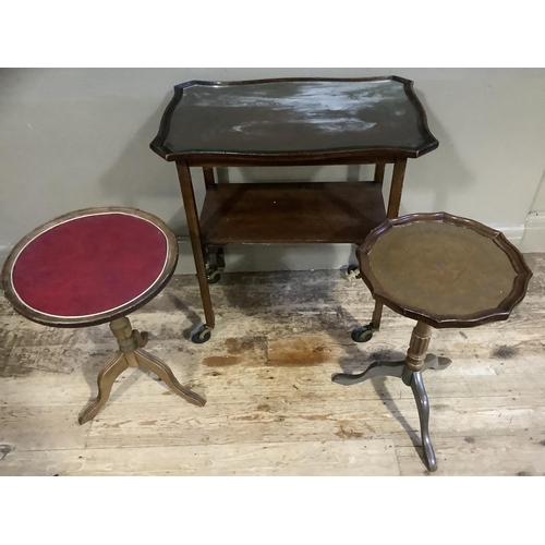 85 - A mahogany two tier occasional table on castors, two tripod occasional tables