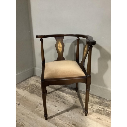 88 - A reproduction mahogany finish corner chair with inlaid decoration