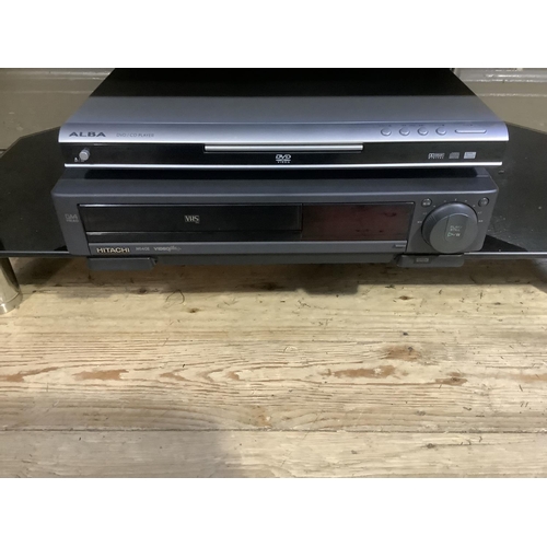 90 - A Sony Bravia television with glass stand, Alba DVD player and VHS player