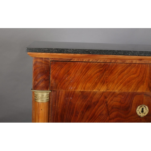 372 - A Continental walnut secetaire-a-abbatant with black marble surface, having a frieze drawer above a ... 